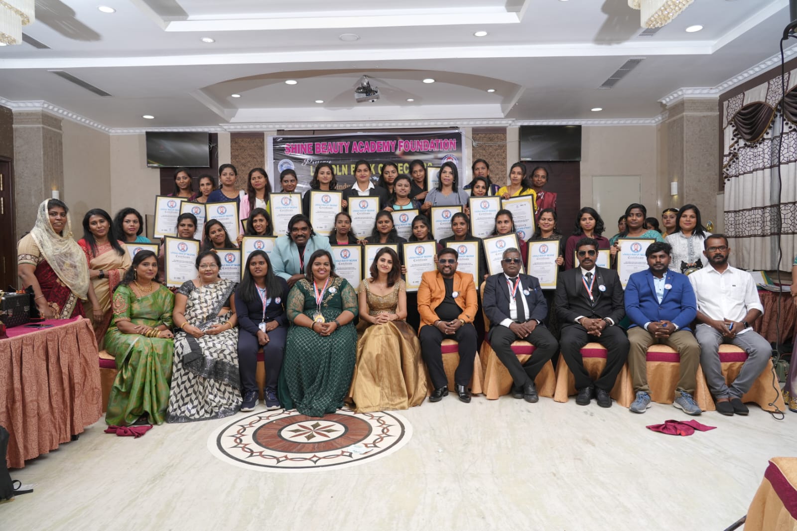 Most number of beauticians gathered together  performing Hindu bridal makeup on models in least time.